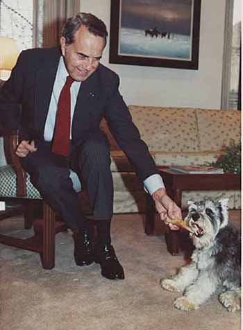 Senator Dole playing with his dog, Leader